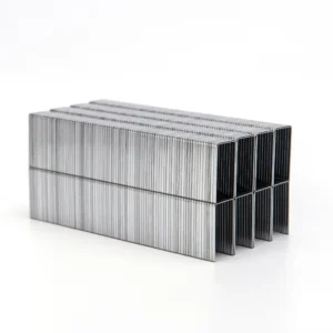 Stacked silver-colored staple strips viewed from their open ends