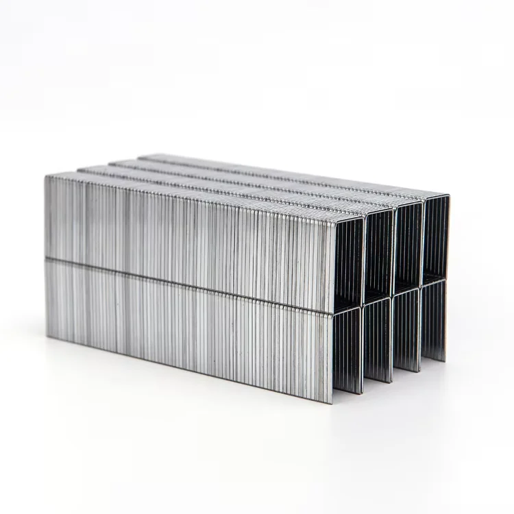 Stacked silver-colored staple strips viewed from their open ends
