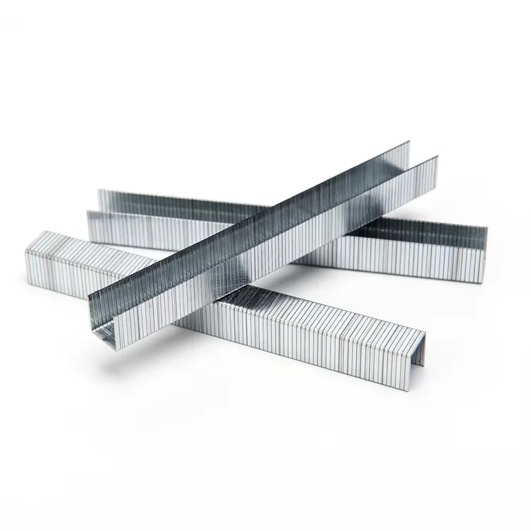 Three crossed strips of staples on a white background